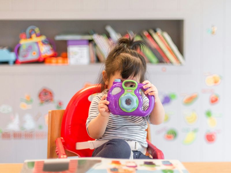 A young child playing in a pediatric therapy room